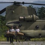 
              Team Rubicon's disaster response members unload aid at the airport to take to the hospital where they are treating residents injured in the 7.2 magnitude earthquake in Les Cayes, Haiti, Thursday, Aug. 19, 2021. (AP Photo/Fernando Llano)
            