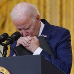 
              President Joe Biden pauses as he listens to a question about the bombings at the Kabul airport that killed at least 12 U.S. service members, from the East Room of the White House, Thursday, Aug. 26, 2021, in Washington. (AP Photo/Evan Vucci)
            