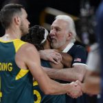 
              United States's head coach Gregg Popovich, right, hugs Australia's Patty Mills (5) at the end of men's basketball semifinal game between the United States and Australia at the 2020 Summer Olympics, Thursday, Aug. 5, 2021, in Saitama, Japan. (AP Photo/Eric Gay)
            