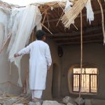 
              An Afghan boy stands at a damaged house after airstrikes in two weeks ago during a fight between government forces and the Taliban in Lashkar Gah, Helmand province, southwestern, Afghanistan, Saturday, Aug. 21, 2021. (AP Photo/Abdul Khaliq)
            