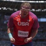 
              Ryan Crouser, of United States, reacts after winning the final of the men's shot put at the 2020 Summer Olympics, Thursday, Aug. 5, 2021, in Tokyo. (AP Photo/Matthias Schrader)
            