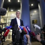 
              Founder of the Baring Vostok investment fund Michael Calvey speaks to journalists as he leaves a court room after a hearing in Moscow, Russia, Thursday, Aug. 5, 2021. U.S. investor, Calvey was accused of embezzlement from the Russian bank Vostochny, in which his investment firm Baring Vostok has a controlling stake, charges he denied. (AP Photo/Alexander Zemlianichenko)
            