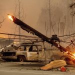
              A utility pole burns as the Dixie Fire tears through the Greenville community of Plumas County, Calif., on Wednesday, Aug. 4, 2021. The fire leveled multiple historic buildings and dozens of homes in central Greenville. (AP Photo/Noah Berger)
            
