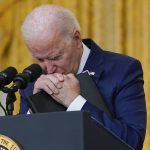
              President Joe Biden pauses as he listens to a question about the bombings at the Kabul airport that killed at least 12 U.S. service members, from the East Room of the White House, Thursday, Aug. 26, 2021, in Washington. (AP Photo/Evan Vucci)
            