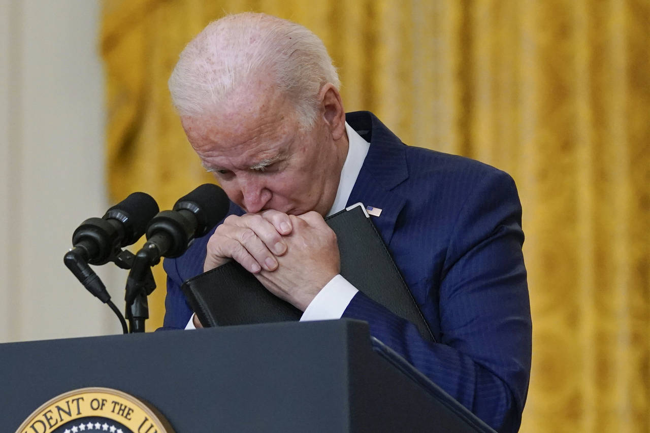President Joe Biden pauses as he listens to a question about the bombings at the Kabul airport that...