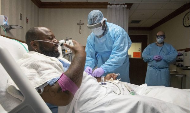 COVID-19 patient Cedric Daniels, 37, of Gonzales, La., recuperates at Our Lady of the Lake Regional...