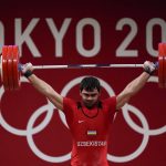 
              Akbar Djuraev of Uzbekistan competes in the men's 109kg weightlifting event at the 2020 Summer Olympics, Tuesday, Aug. 3, 2021, in Tokyo, Japan. (AP Photo/Seth Wenig)
            