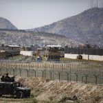 
              In this image provided by the Department of Defense, paratroopers assigned to the 1st Brigade Combat Team, 82nd Airborne Division, conduct security as they continue to help facilitate evacuations at Hamid Karzai International Airport in Kabul, Afghanistan, Wednesday, Aug 25, 2021. (Department of Defense via AP)
            