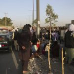 
              Hundreds of people gather near an evacuation control checkpoint during ongoing evacuations at Hamid Karzai International Airport, in Kabul, Afghanistan, Wednesday, Aug. 25, 2021. The Taliban wrested back control of Afghanistan nearly 20 years after they were ousted in a U.S.-led invasion following the 9/11 attacks. Their return to power has pushed many Afghans to flee, fearing reprisals from the fighters or a return to the brutal rule they imposed when they last ran the country. (AP Photo)
            