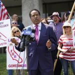 
              Radio talk show host Larry Elder speaks to supporters during a campaign stop Tuesday, July 13, 2021, in Norwalk, Calif. Elder announced Monday that he is running for governor of California. (AP Photo/Marcio Jose Sanchez)
            