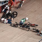 
              Riders crash during the track cycling women's omnium scratch race at the 2020 Summer Olympics, Sunday, Aug. 8, 2021, in Izu, Japan. (AP Photo/Thibault Camus)
            