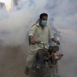 
              Disinfectant is sprayed in a market area in an effort to contain the outbreak of the coronavirus, in Karachi, Pakistan, Monday, Aug. 2, 2021. (AP Photo/Fareed Khan)
            