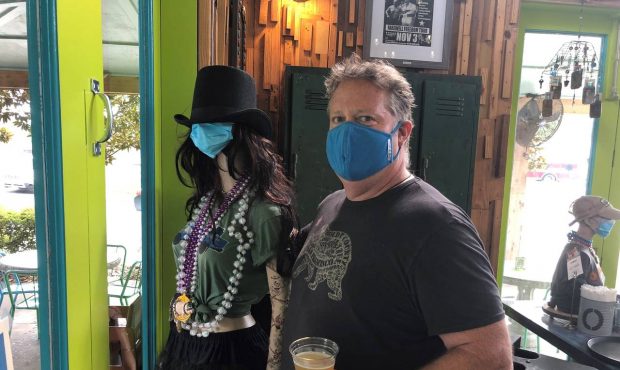 Brack May poses with a masked mannequin in his New Orleans restaurant, Cowbell, on Friday, Aug. 6, ...