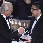 
              FILE - In this June 14, 2018 file photo, Sweden's King Carl Gustaf, left, shakes with hands with Ahmad Sarmast the founder of the Afghanistan National Institute of Music, after awarding him the Polar Music Prize, in Stockholm. A few years after the Taliban were ousted in 2001 Sarmast left his home in Melborne, Australia where he had sought asylum in the 90s, on a mission: to revive music in the country of his birth. Sarmast left Kabul on July 12, 2021, never imagining that just weeks later the whole project would be endangered. (Henrik Montgomery/TT News Agency via AP, File)
            