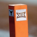 
              FILE - In this Sept. 15, 2018, file photo, the Big 12 conference logo is seen on a pylon during the first half of an NCAA college football game between Texas and USC in Austin, Texas. Texas and Oklahoma made a request Tuesday, July 27, 2021, to join the Southeastern Conference — in 2025 —- with SEC Commissioner Greg Sankey saying the league would consider it in the “near future.” (AP Photo/Eric Gay, File)
            