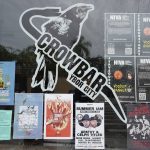 Posters promoting upcoming events appear on the window at Crowbar, a live music venue in Ybor City's historical district, on Aug. 23, 2021, in Tampa, Fla. The music industry is moving toward vaccine mandates for concertgoers, but local and state laws have created murky legal waters for COVID-19 rules in venues. Crowbar once hosted about 300 concerts a year, mostly touring bands. It managed to stay afloat and reopen last fall, hosting about six shows a month. But with cases surging in Florida, show cancellations have racked up and attendance has plummeted. (AP Photo/Chris O'Meara)