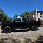 
              Gerald Ortiz pulls up in his truck to receive food at a food bank on Thursday, Sept. 23, 2021, in Chimayó, New Mexico. Ortiz said he regretted buying the truck a few months before the pandemic, and getting laid off from the company where he worked for 20 years. Half of Ortiz' unemployment, about $600 per month, has gone to his truck payments. To pay his bills he's cut back to eating only one meal per day. (AP Photo/Cedar Attanasio)
            