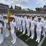 
              The Brigade of Midshipmen stand at attention during the National Anthem before an NCAA college football game between Navy and Air Force, Saturday, Sept. 11, 2021, in Annapolis, Md. (AP Photo/Terrance Williams)
            