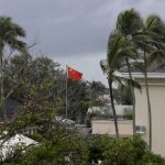 
              FILE - In this April 8, 2019, file photo, a Chinese flag flies outside the Chinese Embassy in Nuku'alofa, Tonga. The Sydney-based think tank Lowy Institute released its annual Pacific Aid Map, Wednesday, Sept. 29, 2021, saying China gave significantly less aid to the Pacific in recent years despite Beijing’s diplomatic efforts to increase its influence in the region. (AP Photo/Mark Baker, File)
            
