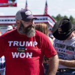 Michael Green waits for the start of former President Donald Trump's Save America rally in Perry, Ga., on Saturday, Sept. 25, 2021. (AP Photo/Ben Gray)