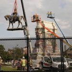 
              Crews remove one of the country's largest remaining monuments to the Confederacy, a towering statue of Confederate General Robert E. Lee on Monument Avenue in Richmond, Va., Wednesday, Sept. 8, 2021. (AP Photo/Steve Helber)
            