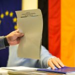 
              A man casts his vote for Germany's national parliament election at a polling station in Berlin, Germany, Sunday, Sept. 26, 2021. German voters are choosing a new parliament in an election that will determine who succeeds Chancellor Angela Merkel after her 16 years at the helm of Europe's biggest economy.(AP Photo/Markus Schreiber)
            