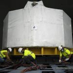 
              Workers receive a central solinoid magnet for the ITER project in Saint-Paul-Lez-Durance, France, Thursday, Sept. 9, 2021. Scientists at the International Thermonuclear Experimental Reactor in southern France took delivery of the first part of a massive magnet so strong its American manufacturer claims it can lift an aircraft carrier. (AP Photo/Daniel Cole)
            