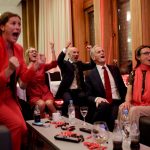
              Labor leader Jonas Gahr Store cheers after seeing the exit poll during the Labor Party's election party at Folkets hus in the 2021 Norwegian parliamentary elections, in Oslo, Monday, Sept. 13, 2021. (Javad Parsa/NTB via AP)
            