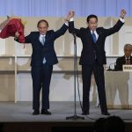 
              Japanese former Foreign Minister Fumio Kishida, right, celebrates with outgoing Prime Minister Yoshihide Suga after being announced the winner of the Liberal Democrat Party leadership election in Tokyo Wednesday, Sept. 29, 2021. Kishida won the governing party leadership election on Wednesday and is set to become the next prime minister, facing the imminent task of addressing a pandemic-hit economy and ensuring a strong alliance with Washington to counter growing regional security risks. (Carl Court/Pool Photo via AP)
            