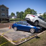 
              Cars are pilled after flooding as a result of the remnants of Hurricane Ida at Oakwood Plaza Apartments complex in Elizabeth, NJ., Thursday, Sept. 2, 2021. (AP Photo/Eduardo Munoz Alvarez)
            