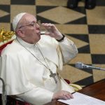 
              Pope Francis drinks as he delivers his speech during a meeting with Hungary's bishops, at Budapest's Museum of Fine Arts, Sunday, Sept. 12, 2021. Francis is opening his first foreign trip since undergoing major intestinal surgery in July, embarking on an intense, four-day, two-nation trip to Hungary and Slovakia that he has admitted might be overdoing it. (AP Photo/Gregorio Borgia)
            