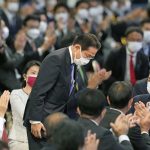 
              Japan’s former Foreign Minister Fumio Kishida bows as he won in the Liberal Democrat Party leadership election in Tokyo Wednesday, Sept. 29, 2021. Kishida has won the governing party leadership election and is set to be become the next prime minister. (Kyodo News via AP)
            