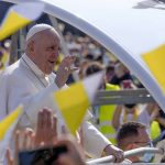 
              Pope Francis blesses faithful as he arrives on his pope-mobile to celebrate a Byzantine rite Mass at Mestska sportova hala Square, in Presov, Slovakia, Tuesday, Sept. 14, 2021. Pope Francis is on a four-day pilgrimage to Hungary and Slovakia. (AP Photo/Darko Vojinovic)
            