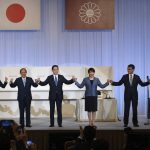 
              Japanese former Foreign Minister Fumio Kishida, center, celebrates with outgoing Prime Minister Yoshihide Suga, second left, and fellow candidates Seiko Noda, left, Sanae Takaichi, second right, and Taro Kono after winning the Liberal Democrat Party leadership election in Tokyo Wednesday, Sept. 29, 2021. Kishida won the governing party leadership election on Wednesday and is set to become the next prime minister, facing the imminent task of addressing a pandemic-hit economy and ensuring a strong alliance with Washington to counter growing regional security risks. (Carl Court/Pool Photo via AP)
            