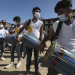 Devotees play traditional drums during the annual Indra Jatra festival in Kathmandu, Nepal, Sunday, Sept. 19, 2021. The feast of Indra Jatra marks the return of the festival season in the Himalayan nation two years after it was scaled down because the pandemic. (AP Photo/Niranjan Shrestha)