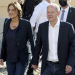 
              Olaf Scholz, right, top candidate for chancellor of the Social Democratic Party (SPD), and his wife Britta Ernst, left, arrive at a polling station in Potsdam, Germany, Sunday, Sept. 26, 2021. On Sunday, Sept. 26, 2021 about 60.4 million people in the nation of 83 million are eligible to elect the new Bundestag, or lower house of parliament, which will elect the next head of government. (AP Photo/Michael Sohn)
            