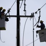 
              Crews work on power lines that were damaged in the aftermath of Hurricane Ida, Friday, Sept. 3, 2021, in LaPlace, La. (AP Photo/Matt Slocum)
            