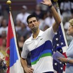 
              Novak Djokovic, of Serbia, center, waves to the crowd after losing to Daniil Medvedev, of Russia, in the men's singles final of the US Open tennis championships, Sunday, Sept. 12, 2021, in New York. (AP Photo/Elise Amendola)
            