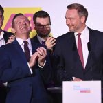 
              Christian Lindner, right, FDP party leader, and the Liberal party leadership stand on stage at the FDP election party fter the first forecasts were announced, in Berlin, Sunday, Sept. 26, 2021. Next to Lindner, Volker Wissing, FDP Secretary-General. Exit polls show the center-left Social Democrats in a very close race with outgoing Chancellor Angela Merkel’s bloc in Germany’s parliamentary election, which will determine who succeeds the long-time leader after 16 years in power. (Sebastian Kahnert/dpa via AP)
            