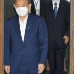 
              Japan’s Prime Minister and head of ruling Liberal Democratic Party Yoshihide Suga, left, and the party's secretary general Toshihiro Nikai, second right, arrive for a meeting in Tokyo Friday, Sept. 2021. Suga won’t run for governing party leadership election, indicating he will step down as Japanese leader later at the end of this month, NHK said. (Kyodo News via AP)
            