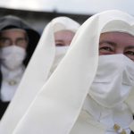 
              Nuns wait for Pope Francis at Lokomotiva Stadium in Košice, Slovakia, Tuesday, Sept. 14, 2021. Francis first trip since undergoing intestinal surgery in July, marks the restart of his globetrotting papacy after a nearly two-year coronavirus hiatus. (AP Photo/Gregorio Borgia)
            