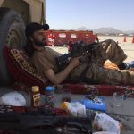 
              A Taliban fighter takes a rest inside the Hamid Karzai International Airport in Kabul, Afghanistan, Sunday, Sept. 5, 2021. (AP Photo/Mohammad Asif Khan)
            
