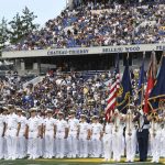 
              The Brigade of Midshipmen stand at attention during pre-game ceremonies before an NCAA college football game between Navy and Air Force, Saturday, Sept. 11, 2021, in Annapolis, Md. (AP Photo/Terrance Williams)
            
