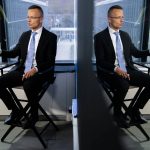 
              Peter Szijjarto, Hungary's minister of foreign affairs and trade, is reflected in studio glass as he speaks during an interview with the Associated Press at United Nations headquarters, Thursday, Sept. 23, 2021, during the 76th Session of the U.N. General Assembly in New York. (AP Photo/John Minchillo)
            