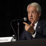 
              In this Aug. 17, 2021 file photo Republican gubernatorial candidate John Cox, right, responds to a question during a debate held by the Sacramento Press Club in Sacramento, Calif. Cox is running to replace Democratic Gov. Gavin Newsom in the Sept. 14 recall election. Democrats hope hope they can keep Newsom in office by driving up turnout.(AP Photo/Rich Pedroncelli, File)
            