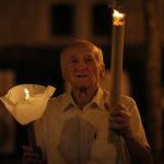 
              A man holds a torch during a procession joined by tens of thousands in Budapest, Hungary, Saturday, Sept. 11, 2021, the day before the final mass of International Eucharistic Congress on which will be attended by Pope Francis. Pope Francis is making his first foreign trip since undergoing intestinal surgery in July, a four-day visit to Hungary and Slovakia starting Sunday. (AP Photo/Vadim Ghirda)
            