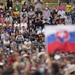 
              Faithful wait for Pope Francis at Lokomotiva Stadium in Košice, Slovakia, Tuesday, Sept. 14, 2021. Francis first trip since undergoing intestinal surgery in July, marks the restart of his globetrotting papacy after a nearly two-year coronavirus hiatus. (AP Photo/Darko Vojinovic)
            