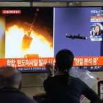 
              People watch a TV showing a file image of North Korea's missiles launch during a news program at the Seoul Railway Station in Seoul, South Korea, Tuesday, Sept. 28, 2021. North Korea on Tuesday fired a suspected ballistic missile into the sea, Seoul and Tokyo officials said, the latest in a series of weapons tests by Pyongyang that raised questions about the sincerity of its recent offer for talks with South Korea. The Korean letters read: "Ballistic missile." (AP Photo/Ahn Young-joon)
            