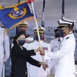 
              Taiwan's President Tsai Ing-wen, left, presents a flag during the commissioning ceremony of the the domestically made Ta Jiang warship at the Suao naval base in Yilan county, Taiwan, Thursday, Sept. 9, 2021. Taiwan's president oversaw the commissioning of a new domestically made navy warship Thursday as part of the island's plan to boost indigenous defense capacity amid heightened tensions with China. (AP Photo/Chiang Ying-ying)
            