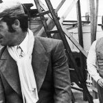 
              FILE - In this 1969 file photo, French actors Jean-Paul Belmondo. left, and Alain Delon are seen during the shooting of a Jacques Deray film, "Borsalino" in Marseille, France. French New Wave actor Jean-Paul Belmondo has died, according to his lawyer’s office on Monday Sept. 6, 2021. (AP Photo/File)
            